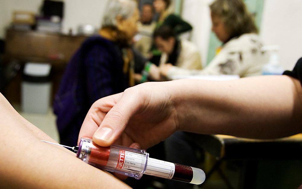 Vrouw laat zich testen op hepatitis-B. Foto ANP