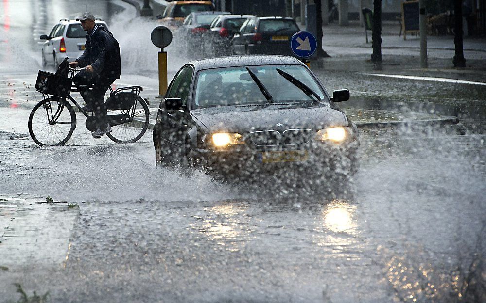 Veel regen vrijdagmorgen in Amsterdam. Foto ANP