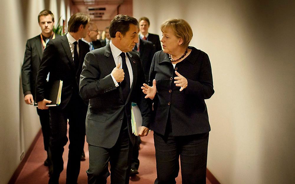 Sarkozy en Merkel.   Foto EPA