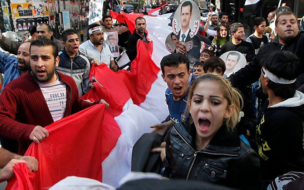 Volgens een Belgische hoogleraar zijn de protesten tegen de Syrische president niet zo massaal als wordt gedacht. De steun voor Assad is echter wel massaal. Foto EPA