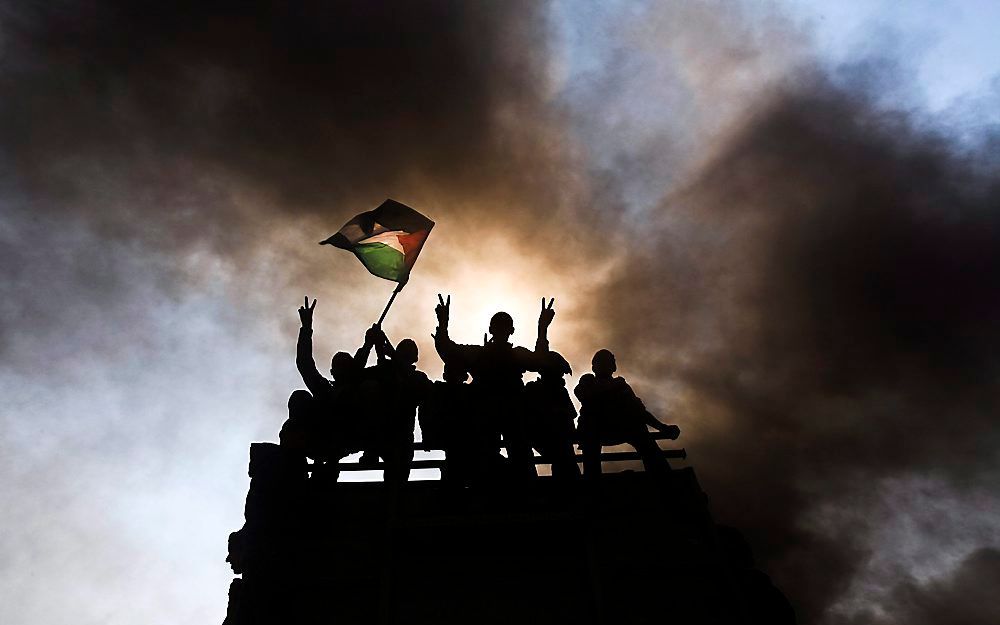 Palestijnse demonstranten doen mee aan een rally bij checkpoint Erez op de Gazastrook. Foto EPA