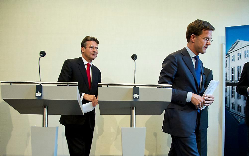 Rutte en Verhagen na de persconferentie. Foto ANP