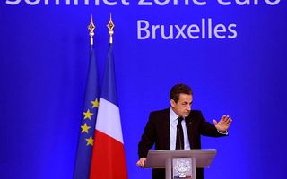 Sarkozy tijdens de persconferentie na de EU-top. Foto EPA
