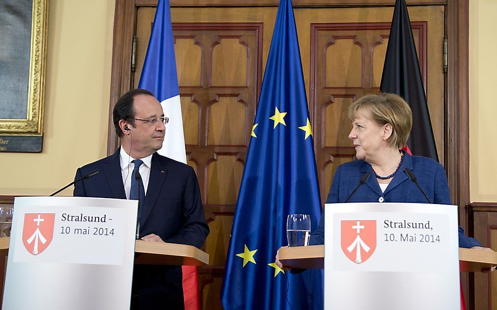 Merkel en Hollande. beeld AFP