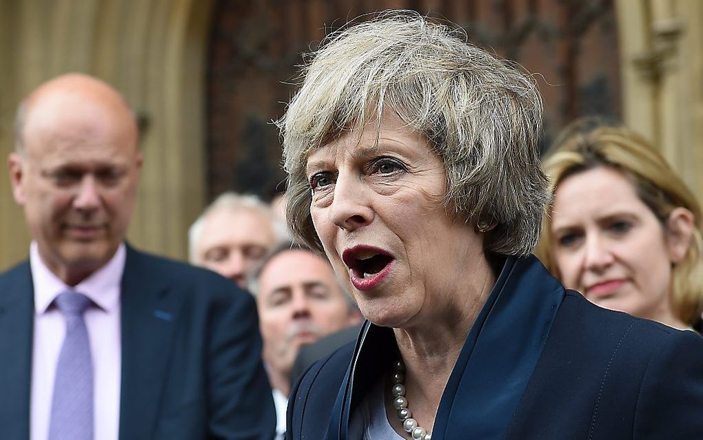 LONDEN. De Britse minister van Binnenlandse Zaken Theresa May wordt morgen premier van Groot-Brittannië. Ze staat voor de lastige taak het land te verenigen en door een brexit heen te loodsen. beeld EPA, Andy Rain