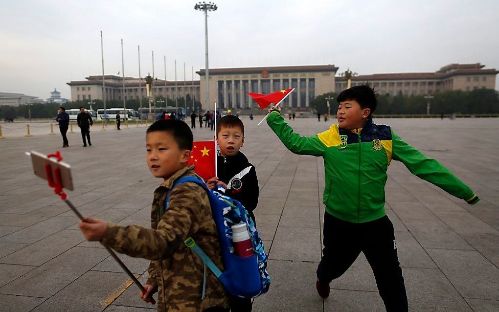 Kinderen in Bejing.  beeld EPA, How Hwee Young