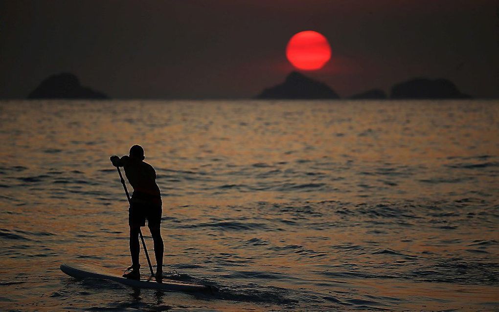 Terwijl op het noordelijk halfrond vrijdag de winter begon, begon op het zuidelijk halfrond de zomer. In Rio de Janeiro werden temperaturen boven de 40 graden celsius verwacht. beeld EPA