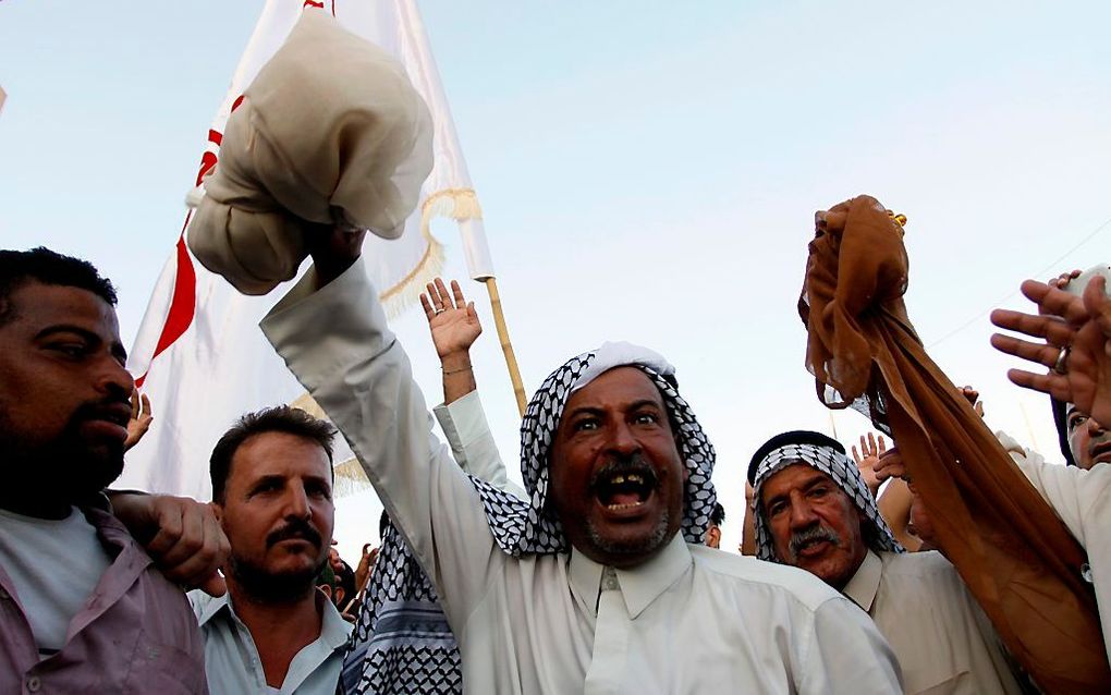 Protesten Basra, afgelopen vrijdag. beeld AFP,  Haidar HAMDANI