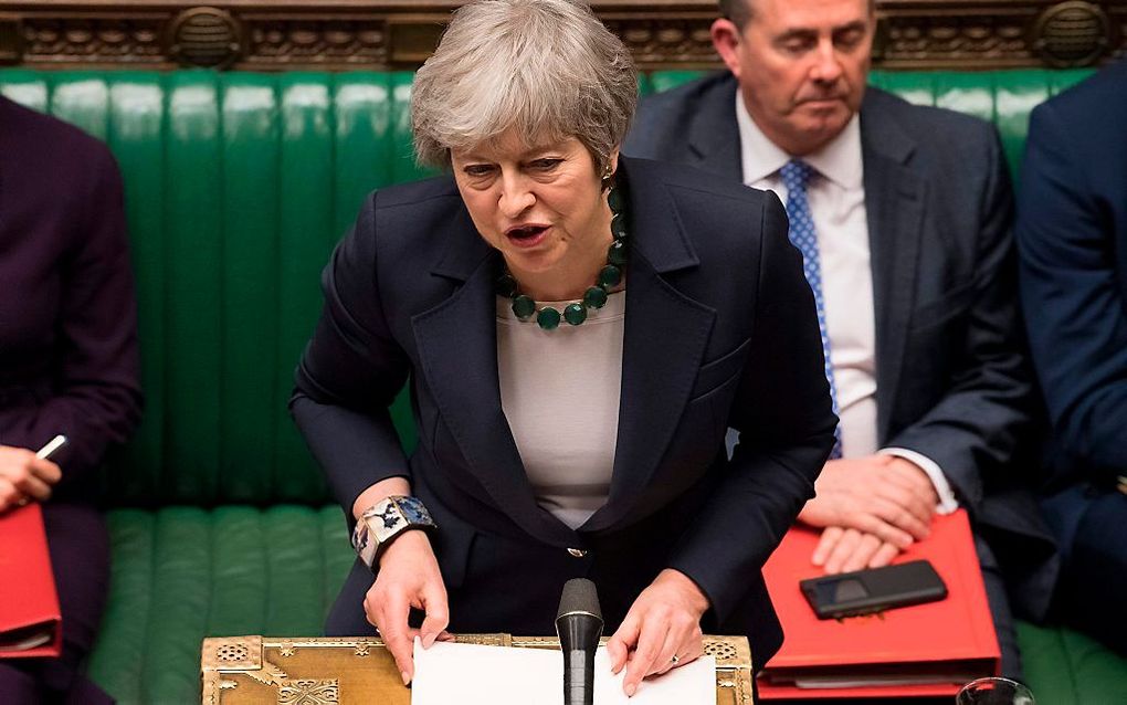 Premier May, woensdagavond in het Britse parlement. beeld AFP, Mark Duffy