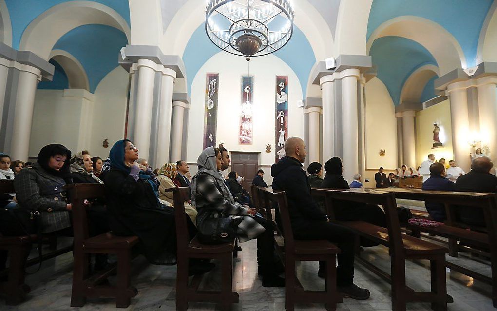 Kerkdienst op de avond voor Kerst in Iran. beeld AFP, Atta Kenare