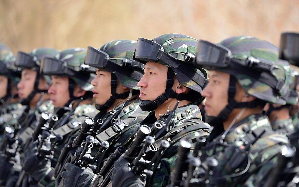 Leden van de Chinese militaire politie.  beeld AFP