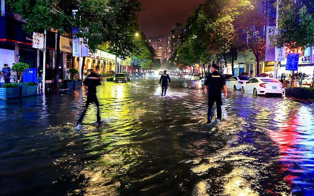 Overstroming in Ashun, China. Meer dan 12 miljoen mensen zijn getroffen door de enorme wateroverlast de laatste maanden. beeld AFP