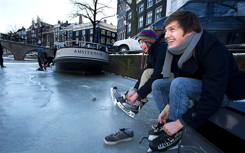 De laatste keer dat Amsterdammers door de binnenstad konden schaatsen was in 2012. beeld ANP