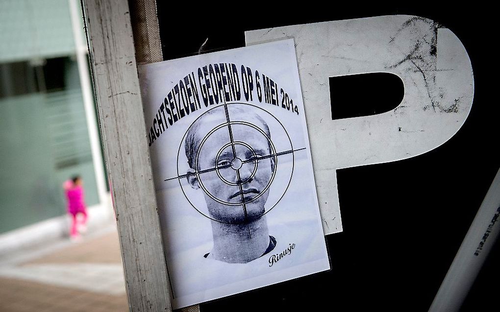 Een poster tijdens een demonstratie tegen de strafkorting van Volkert van der G. De moordenaar van Pim Fortuyn is onder voorwaarden vrij. beeld ANP