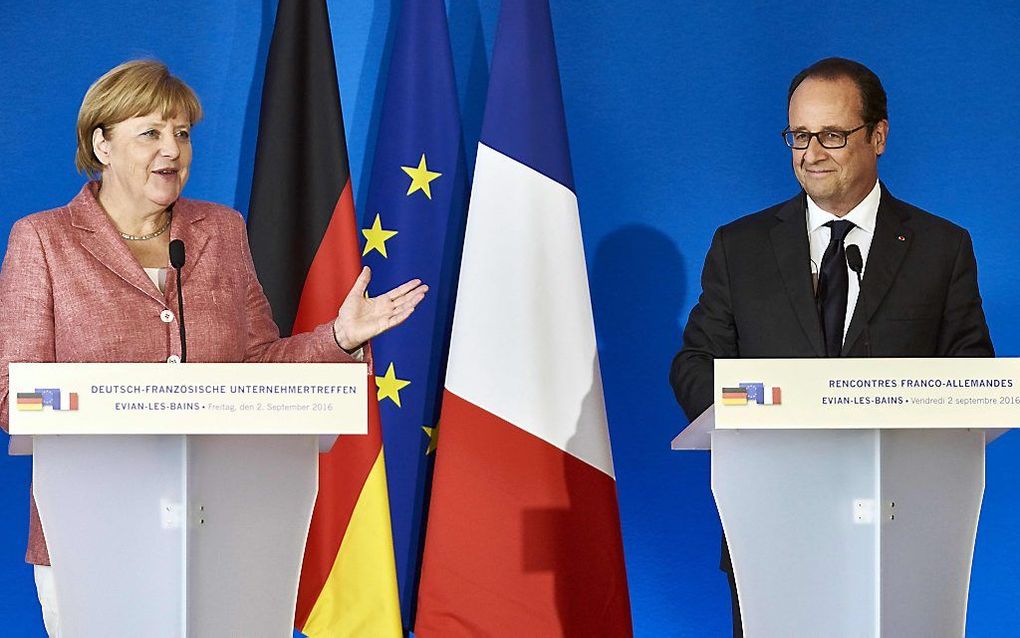 De Duitse Merkel en Franse Hollande. beeld AFP