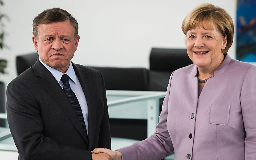 Abdullah en Merkel. beeld AFP