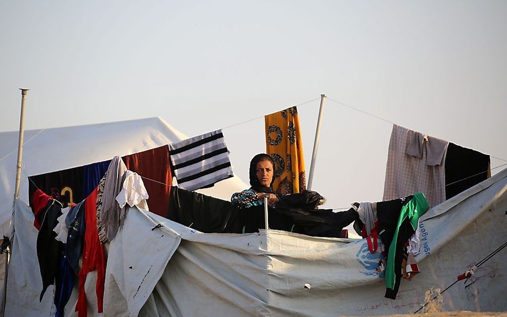 Een uit Mosul gevuchtte vrouw in een vluchtelingenkamp in het noordoosten van Syrië. Beeld AFP