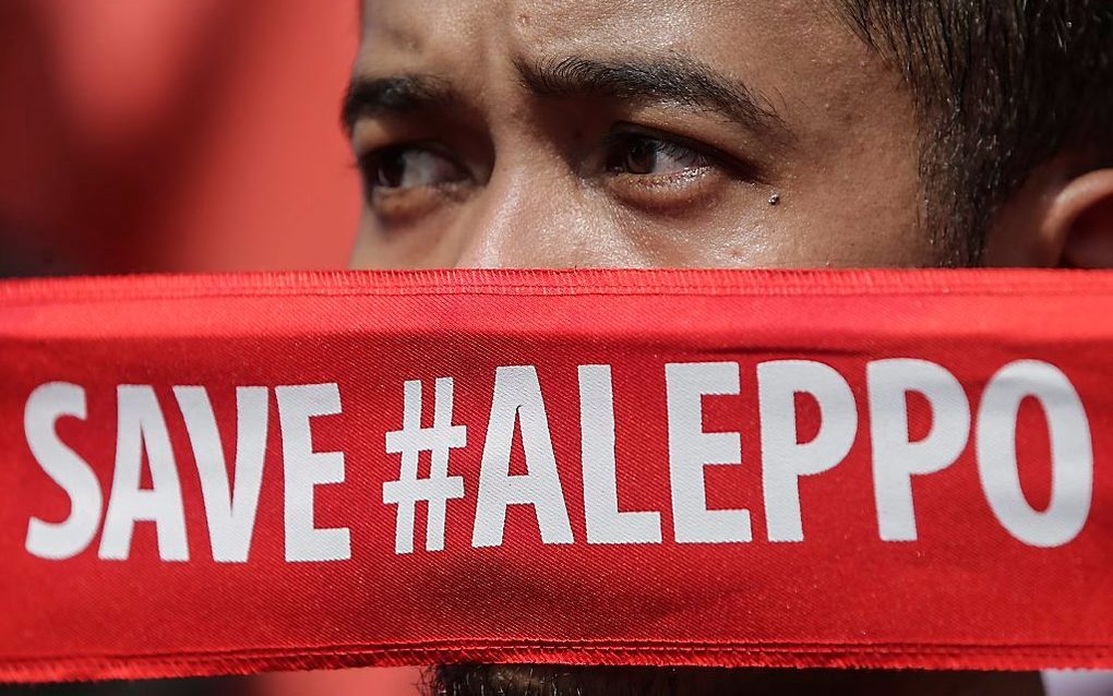 Een Maleisiër protesteert bij de Russchische Ambassade in Kuala Lumpur. beeld EPA