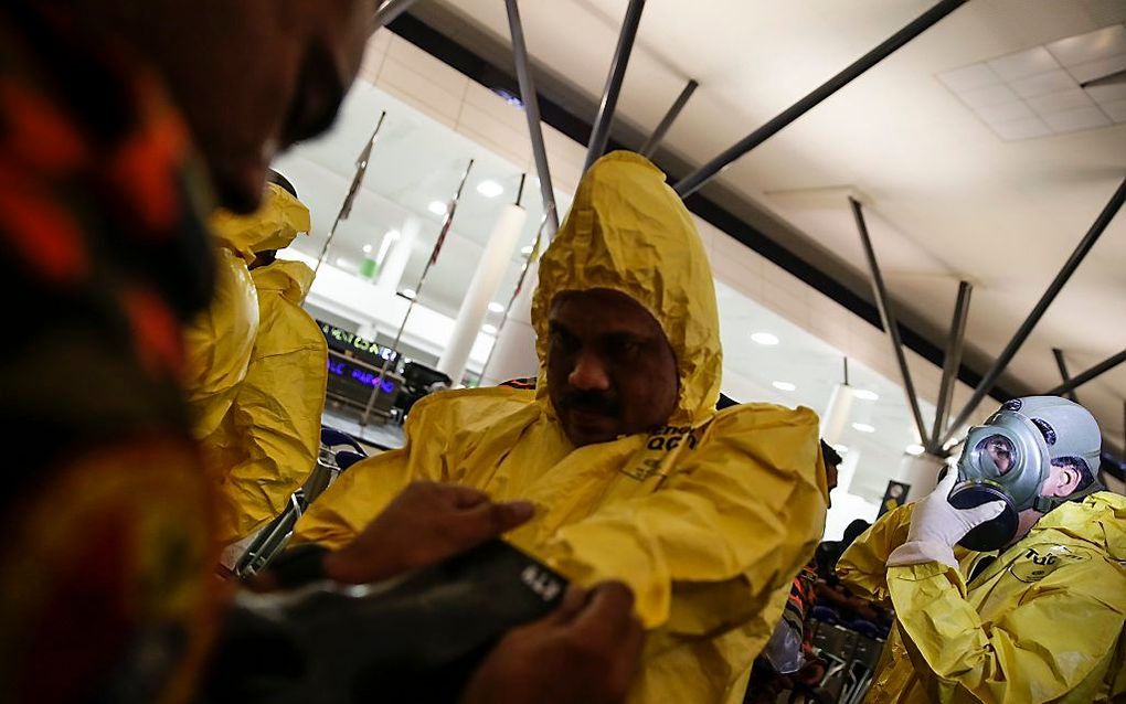 Onderzoek op de luchthaven van Kuala Lumpur. beeld EPA