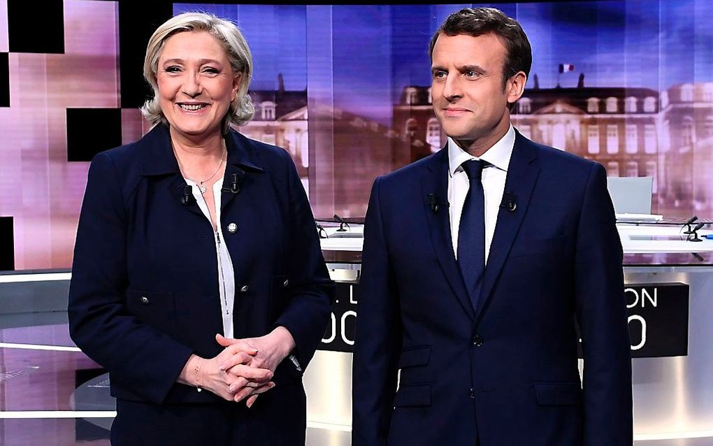 Le Pen (l.) en Macron. beeld AFP