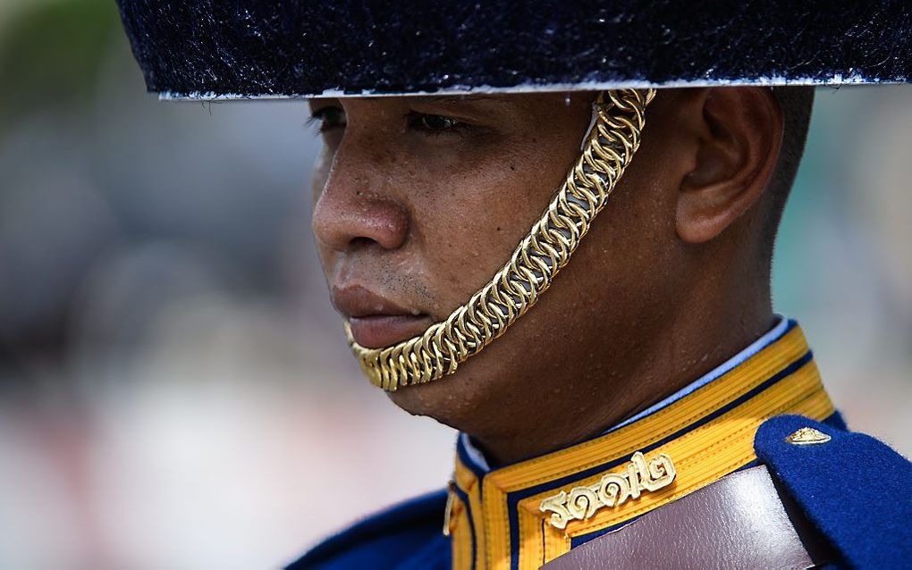 Een Thaise soldaat tijdens de afscheidsceremonie. beeld AFP