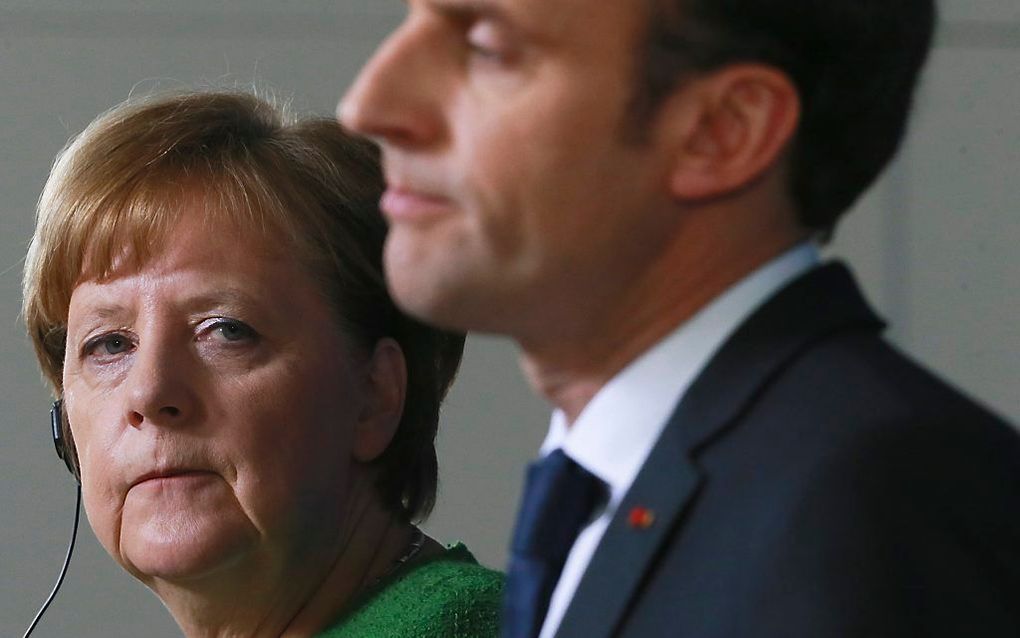 Merkel (l.) en Macron. beeld EPA