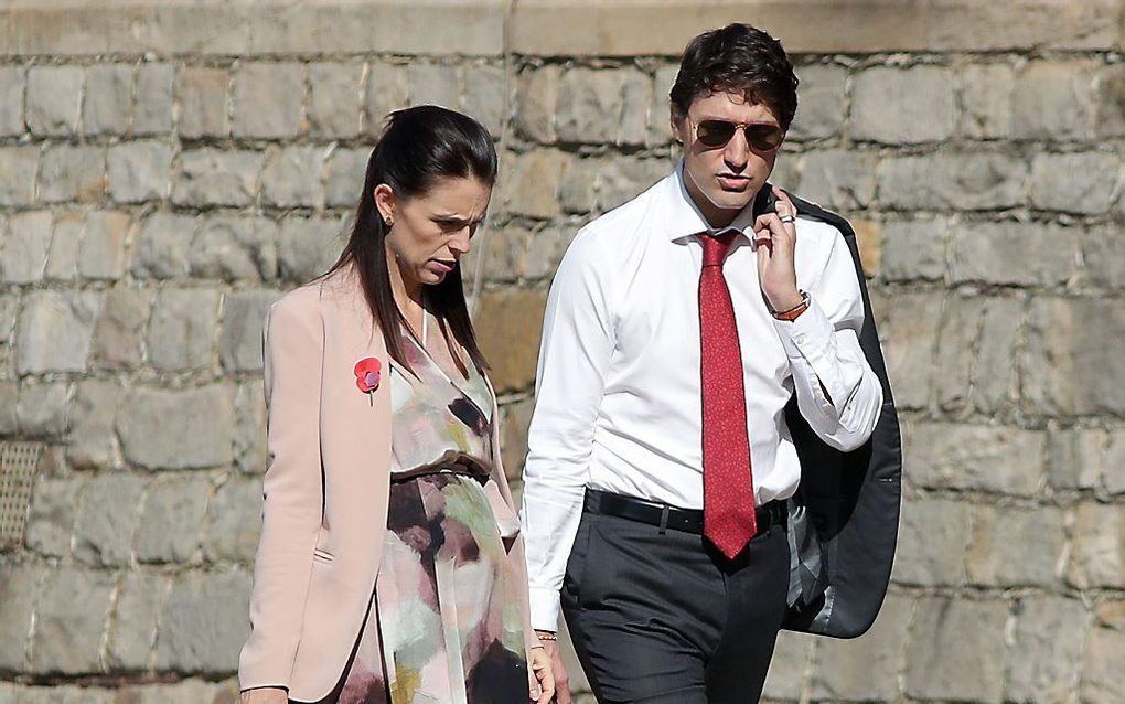 De Australische premier Ardern en haar Canadese ambtgenoot Trudeau. beeld AFP