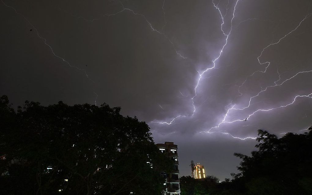 Onweer in New Delhi. beeld AFP