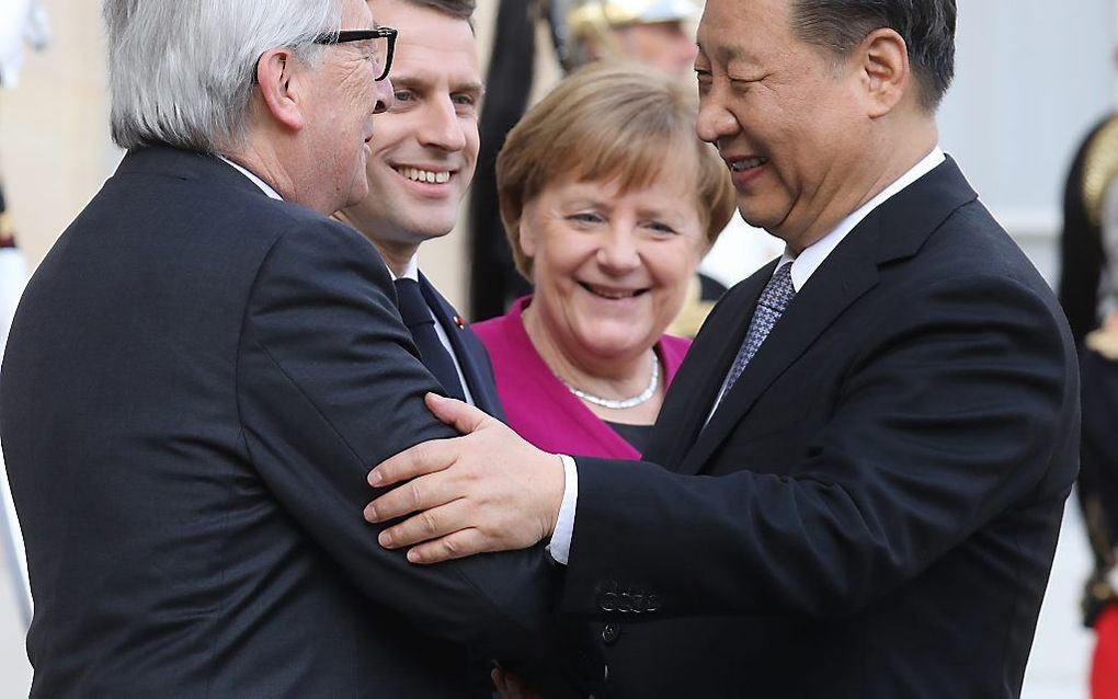 Juncker, Macron, Merkel en Xi Jinping. beeld AFP