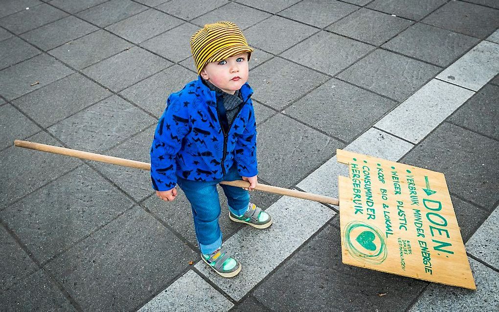 Een jeugdige deelnemer aan een klimaatmars. beeld ANP