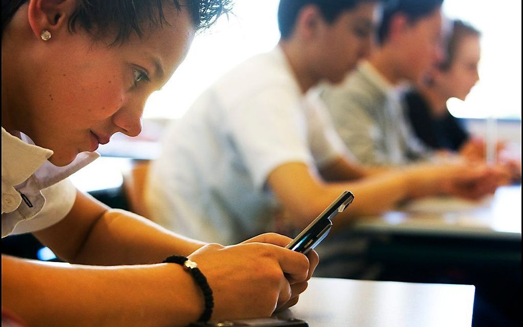 Nederland loopt nog niet warm voor een verbod op telefoongebruik op middelbare scholen. beeld ANP, Robin Utrecht