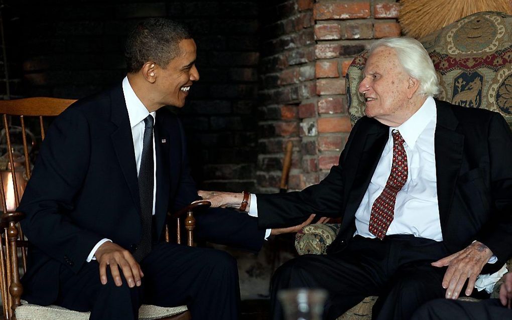 Billy Graham (r.) tijdens een ontmoeting met president Obama in 2013. beeld The White House