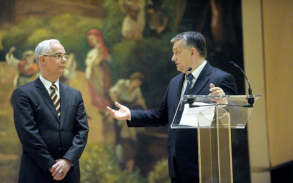 De Hongaarse premier Orbán (r.) en minister en predikant Balog (l.). beeld Gyula Bartos, Hongaars Ministerie van Algemene Zaken