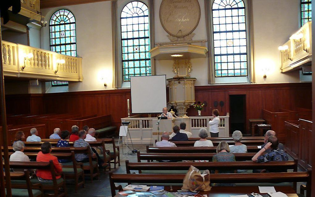 Lutherdag in Utrecht, met achter het spreekgestoelte Dick Akerboom. beeld RD