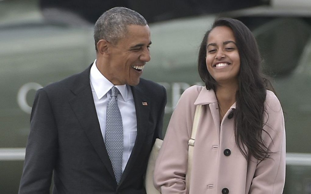 Malia Obama, samen met haar vader. Beeld AFP