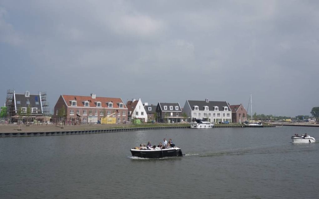 De eerste huizen van het project Waterfront in Harderwijk. Na langdurige opstartproblemen zit er nu schot in het project. beeld Michiel Satink