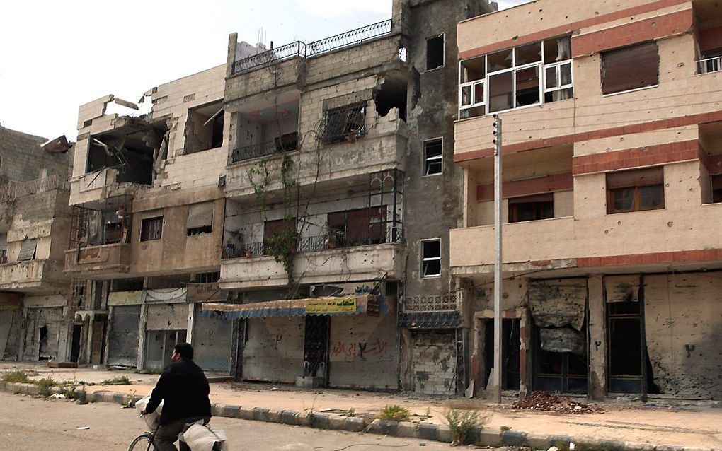 Verwoeste gebouwen in de stad Homs. Foto EPA