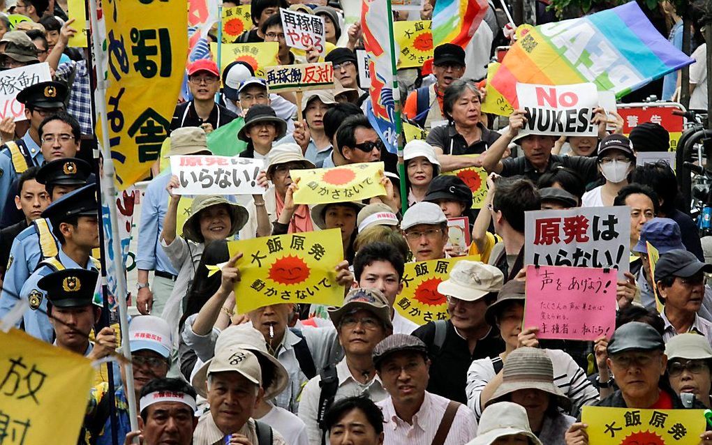 Japanners protesteren tegen de herstart van twee kernreactoren. Foto EPA