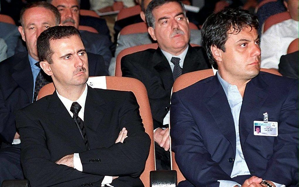 President Bashar al-Assad (l.) en Manaf Tlass (r.). Foto EPA