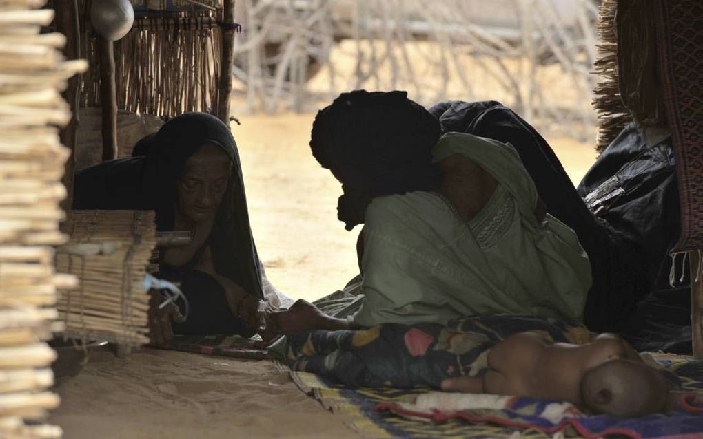 Vluchtelingen uit het noorden van Mali in een vluchtelingenkamp in Dibissi, 300 kilometer ten noorden van de Burkinese hoofdstad Ouagadougou in Burkina Faso, eind juni. Foto AFP