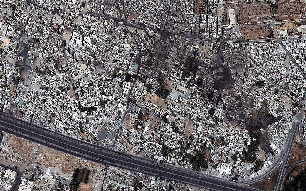 Een satellietfoto van de wijk Qaboon in Damascus op 18 juli toont de sporen van het geweld dat Syrië teistert. De foto is afkomstig van Digital Globe. Foto EPA