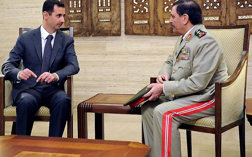 Assad (L), donderdag 19 juli. Foto EPA