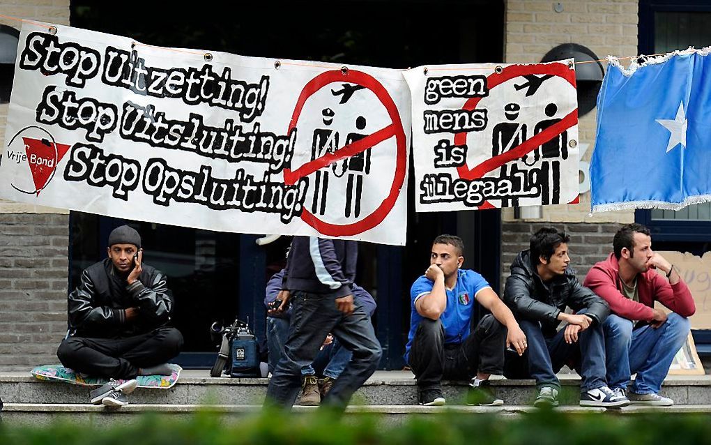 Protesterende Somaliërs bij het kantoor van de Immigratie- en Naturalisatiedienst (IND) in Den Bosch. Foto ANP