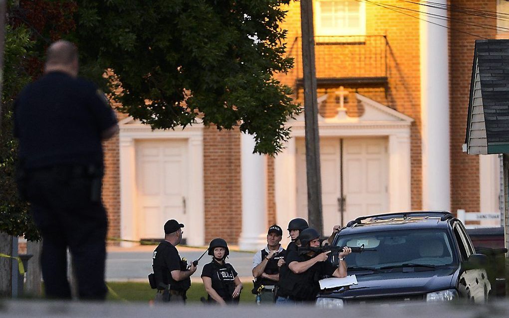 Politie bij het huis van de schutter. Foto EPA