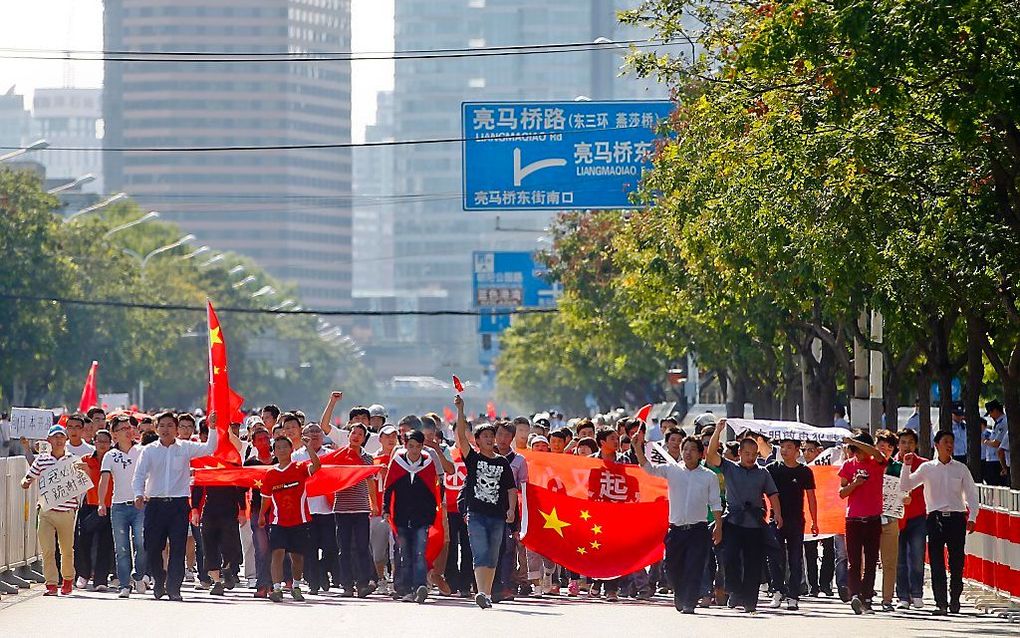 Protesterende Chinezen.   Foto EPA