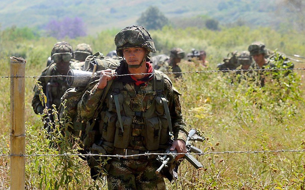 Colombiaanse militairen maken jacht op Farc-strijders, in juli dit jaar. Foto EPA