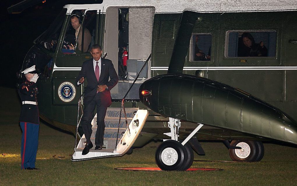 De Amerikaanse president Obama komt aan bij het Witte Huis. Foto EPA