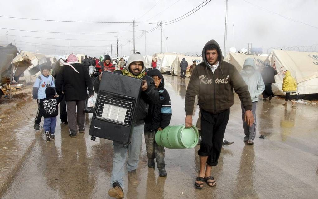 Syriërs in een vluchtelingenkamp in de buurt van de Jordaanse stad Mafraq. Foto EPA