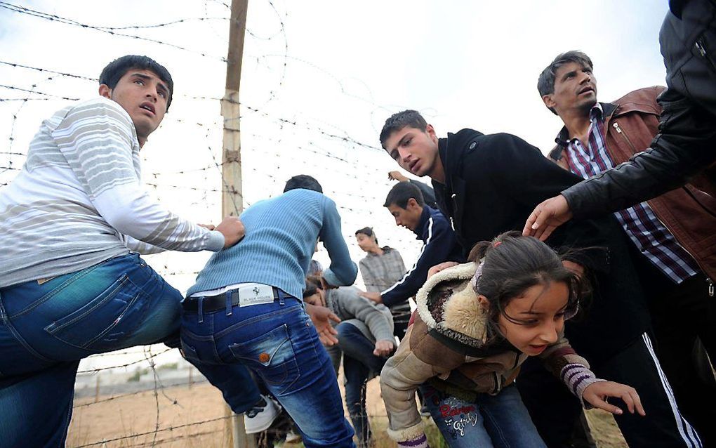 Syrische vluchtelingen bij de grens met Turkije. Foto EPA