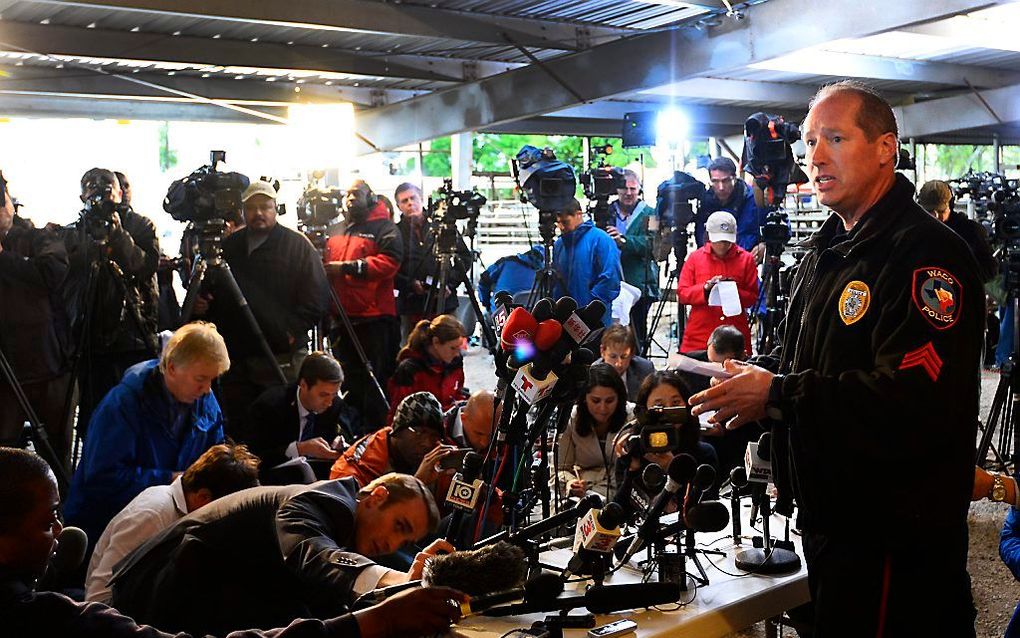 Een politieman tijdens een persconferentie donderdag in West. Foto EPA